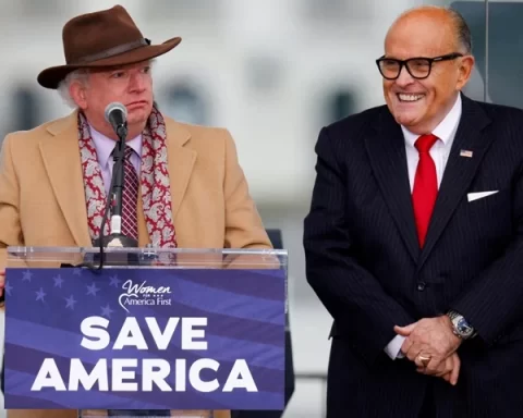 Attorney John Eastman speaks next to U.S. President Donald Trump's personal attorney Rudy Giuliani, as Trump supporters gather ahead of the president’s speech to contest the certification by the U.S. Congress of the results of the 2020 U.S. presidential election on the Ellipse in Washington,Georgia U.S, January 6, 2021. REUTERS/Jim Bourg/File Photo