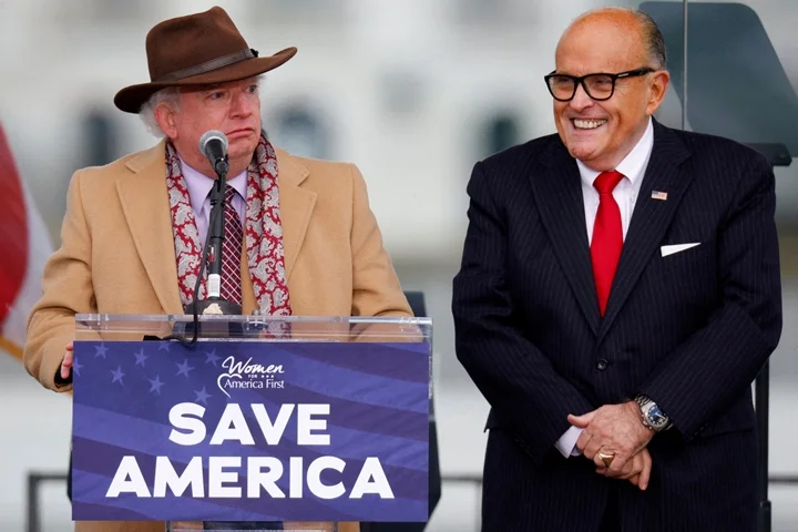 Attorney John Eastman speaks next to U.S. President Donald Trump's personal attorney Rudy Giuliani, as Trump supporters gather ahead of the president’s speech to contest the certification by the U.S. Congress of the results of the 2020 U.S. presidential election on the Ellipse in Washington,Georgia U.S, January 6, 2021. REUTERS/Jim Bourg/File Photo