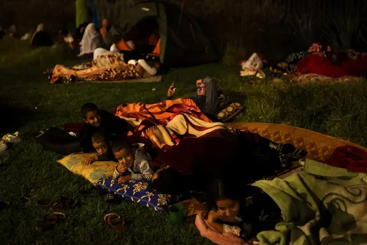 Residents rest along Avenue de la Menara, following a powerful earthquake in Marrakesh, Morroco September 10, 2023.