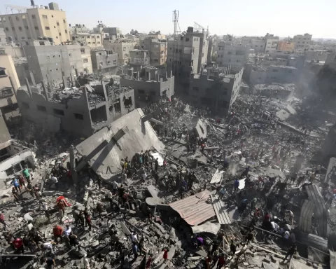 Palestinians inspect the rubble of destroyed buildings following Israeli airstrikes on town of Khan Younis, southern Gaza Strip, Thursday, Oct. 26, 2023. (AP Photo/Mohammed Dahman)