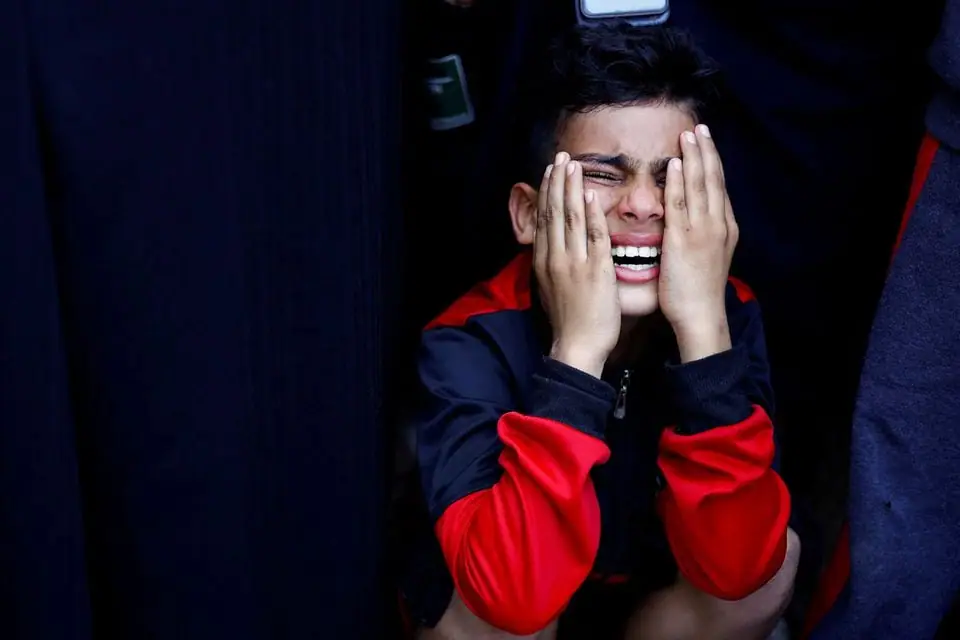 Emad El Salot's son reacts, as he mourns his father who was killed in Israeli strikes, amid the ongoing conflict between Israel and Palestinian Islamist group Hamas, at a hospital, in Khan Younis in the southern Gaza Strip, November 8, 2023. REUTERS/Mohammed Salem