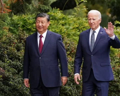 U.S. President Joe Biden waves as he walks with Chinese President Xi Jinping at Filoli estate on the sidelines of the Asia-Pacific Economic Cooperation (APEC) summit, in Woodside, California, U.S., November 15, 2023