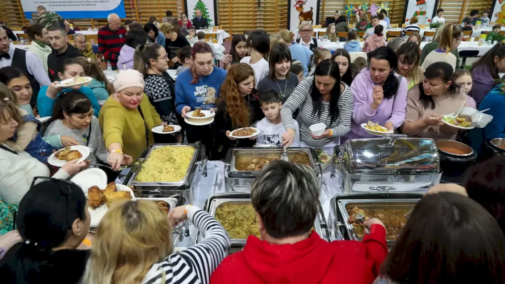 A Christmas feast for refugees at a high school in Bialystok, Poland, in January 2023. Artur Reszko/PAP/EPA