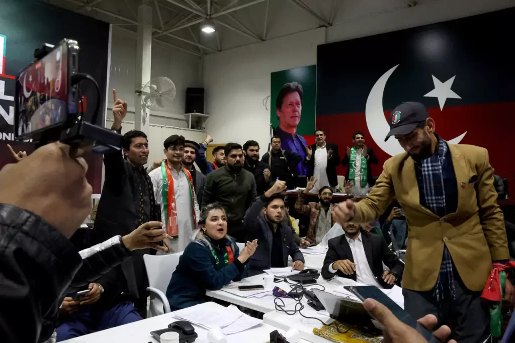 Pakistan Tehreek e Insaf PTI supporters watch the general election results at a PTI office in Islamabad Pakistan