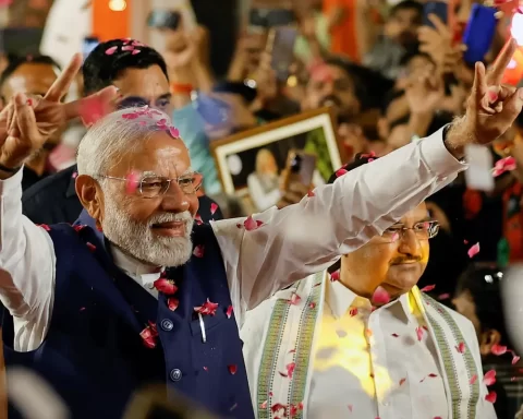 Narendra Modi gestures as he arrives at BJP headquarters in New Delhi