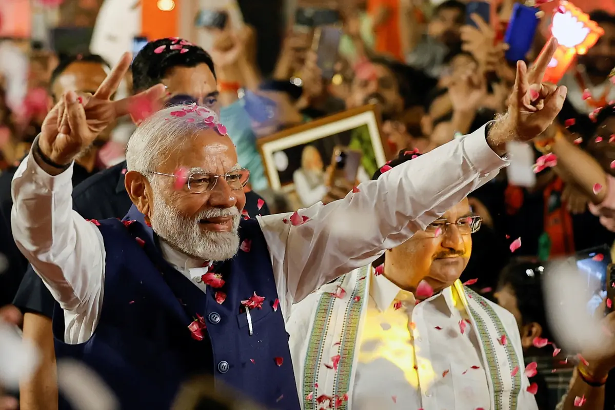 Narendra Modi gestures as he arrives at BJP headquarters in New Delhi