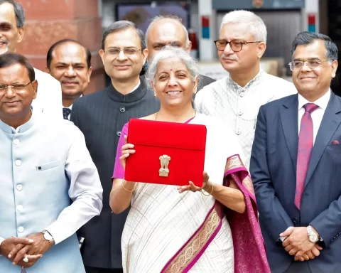 India's Finance Minister Nirmala Sitharaman holds up a folder with the Government of India's logo as she leaves her office to present the union budget in the parliament in New Delhi, India, July 23, 2024. REUTERS/Altaf Hussain