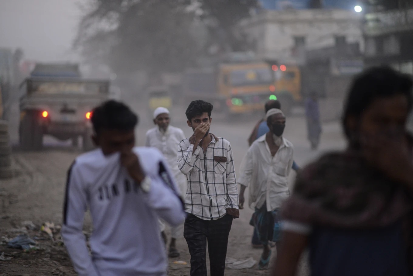 People cover their faces Dhaka Bangladesh