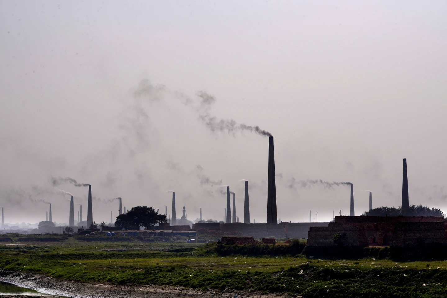 Smoke rises from chimneys Dhaka Bangladesh