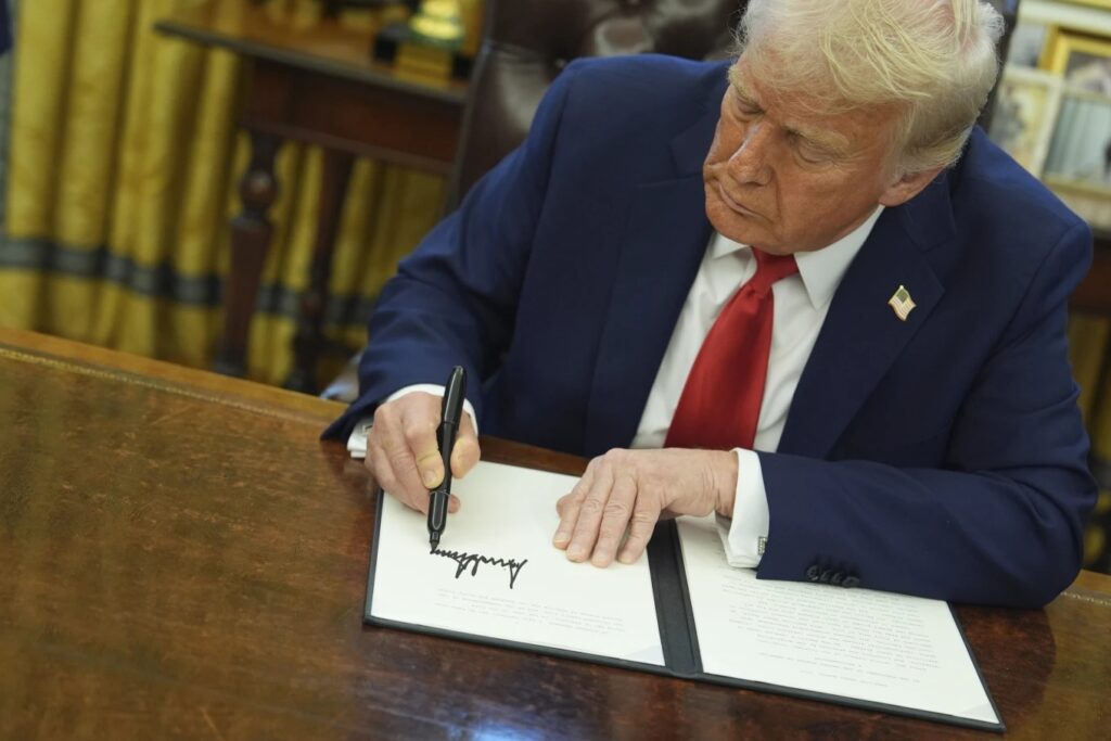 Donald Trump signs an executive order
