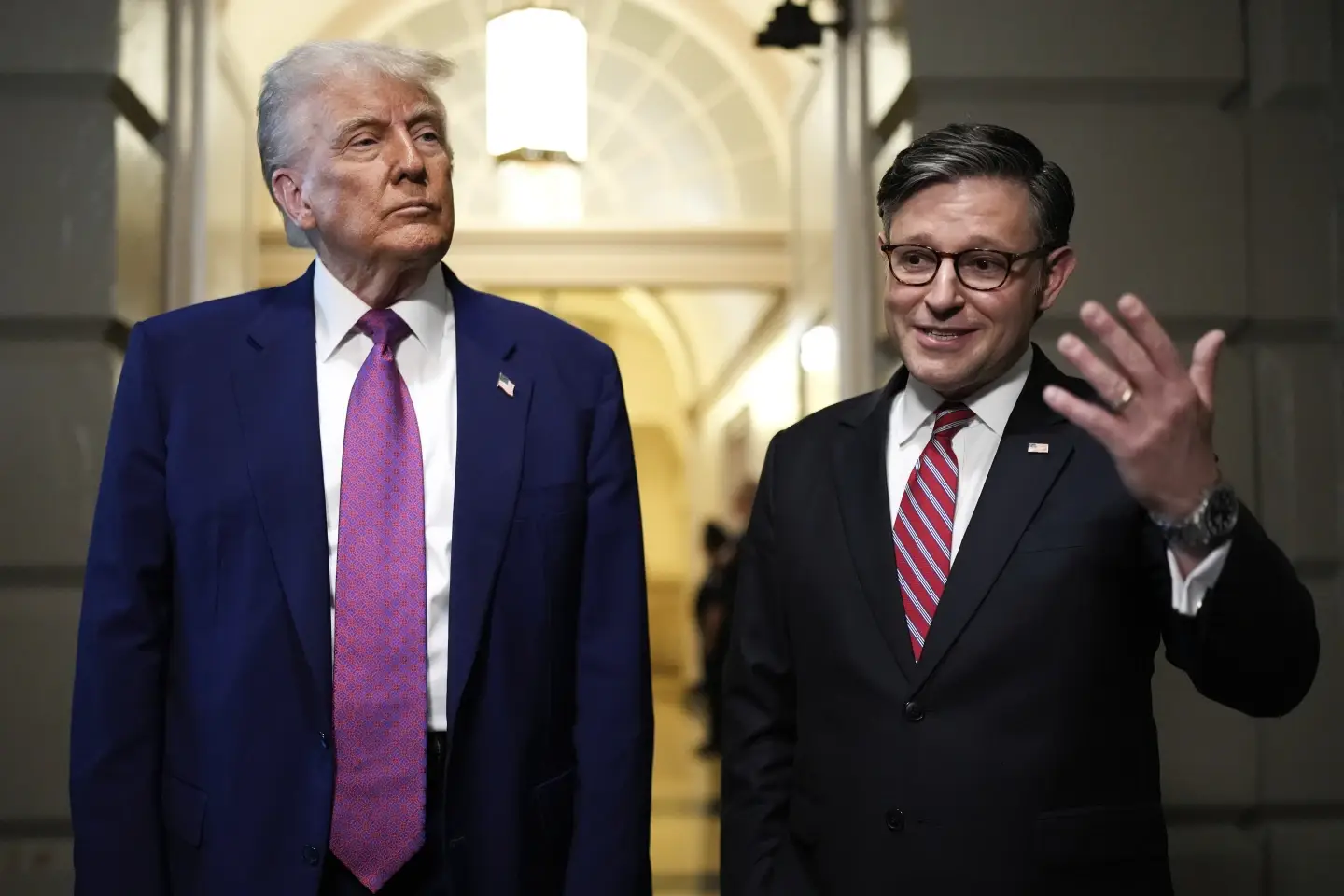 President Donald Trump and Speaker of the House Mike Johnson, R-La., speak to reporters after departing a House Republican conference meeting, Tuesday, May 20, 2025, at the U.S. Capitol in Washington.