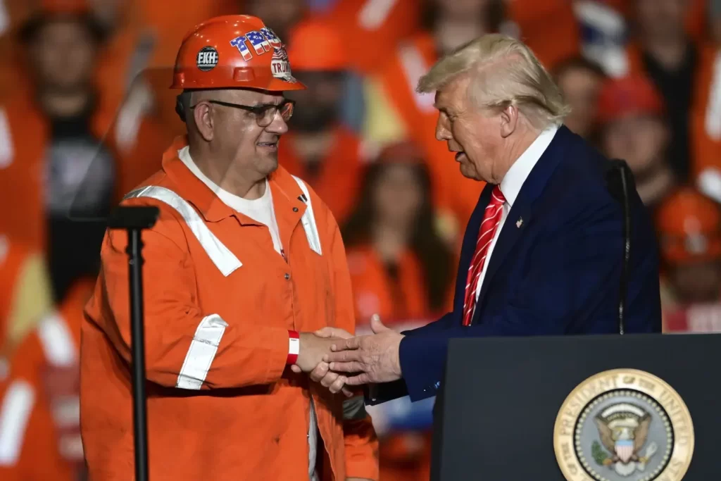 President Donald Trump greets steelworker Brian Pavlack as he speaks at the U.S. Steel Mon Valley Works Irvin plant Friday May 30 2025 in West Mifflin Pa