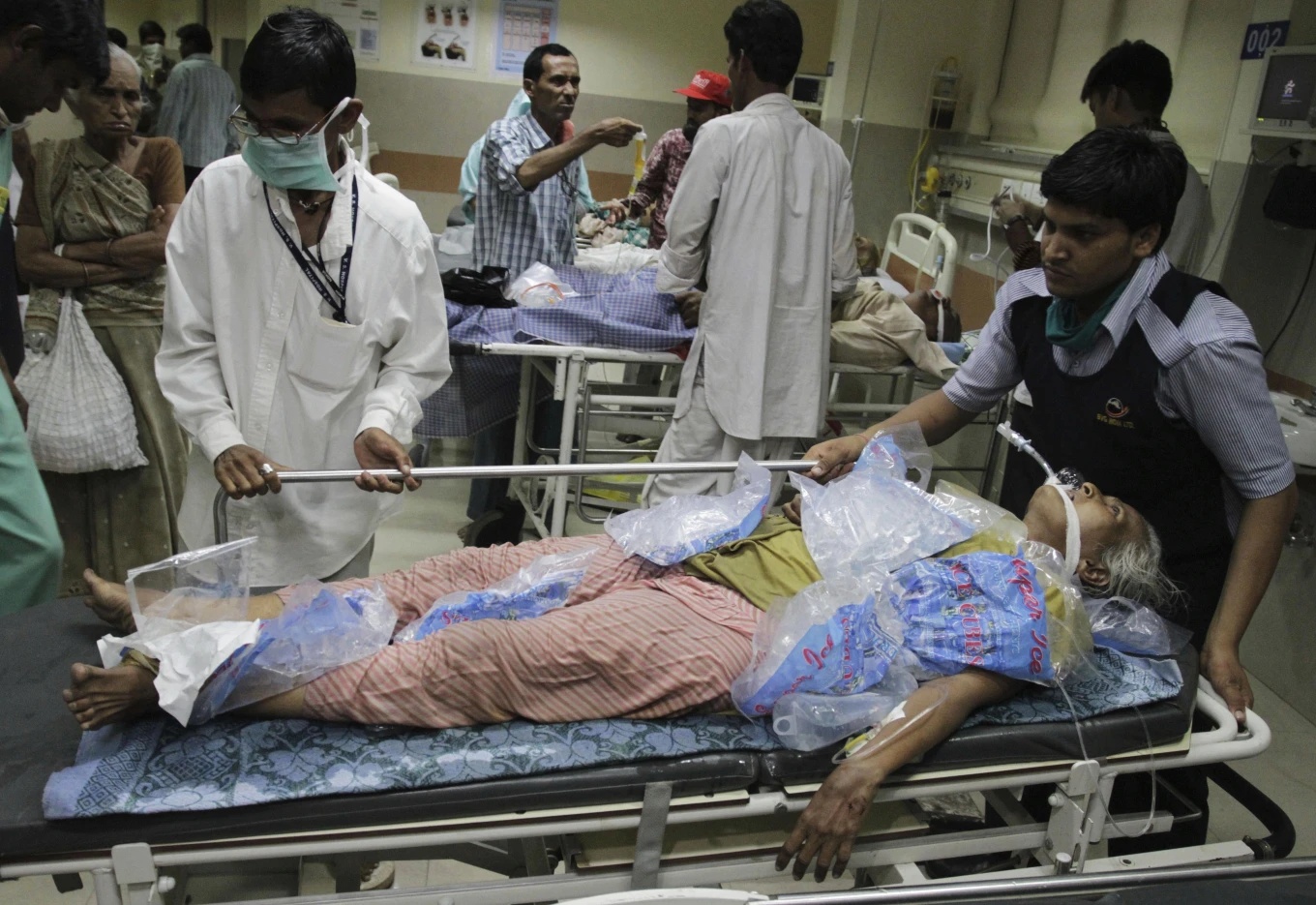 people wheel in heat stroke patient