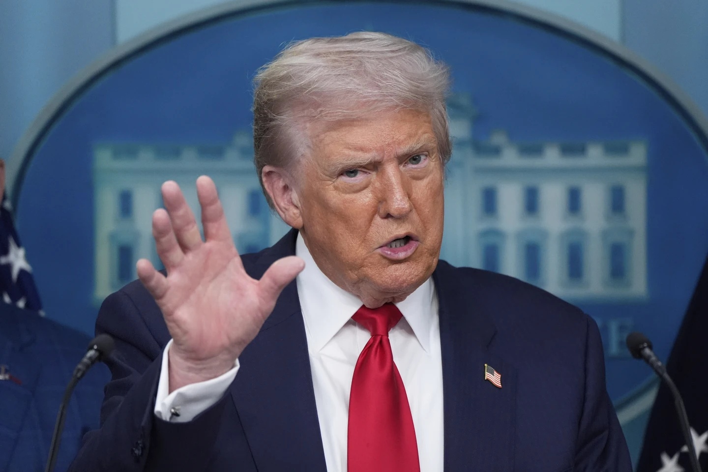 President Donald Trump speaks with reporters