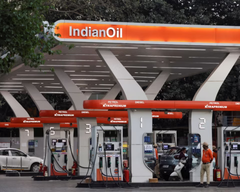 A worker stands next to a machine at an Indian Oil fuel station in New Delhi, India, March 6, 2026. REUTERS/Bhawika Chhabra