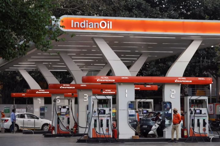 A worker stands next to a machine at an Indian Oil fuel station in New Delhi, India, March 6, 2026. REUTERS/Bhawika Chhabra