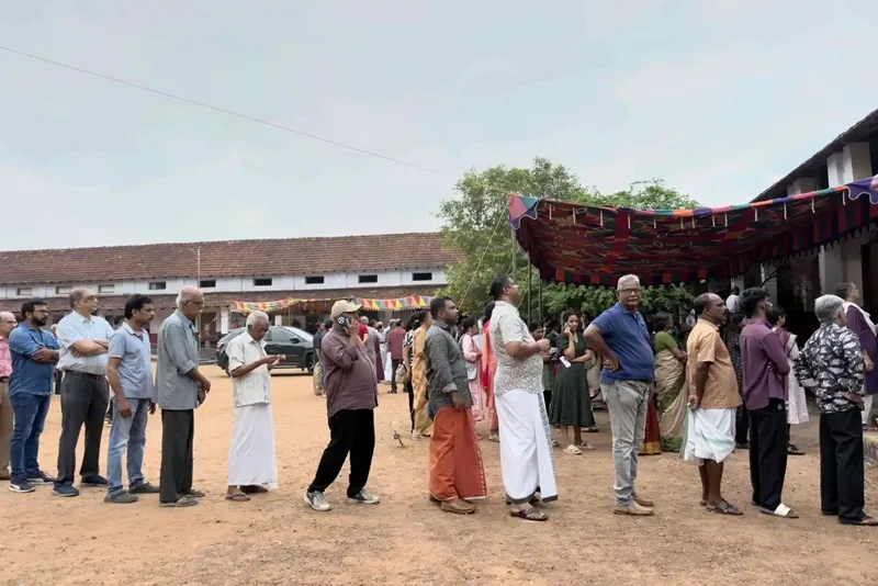 People queue up to vote outside a polling booth during the Kerala state elections in Kochi, India, Thursday, April 9, 2026.