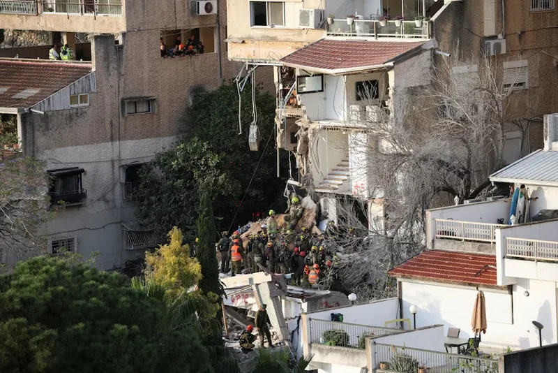 Israel Emergency personnel work at the site of a projectile impact, as the U.S.-Israel conflict with Iran continues, in Haifa, Israel, April 6, 2026. (Photo: Reuters)