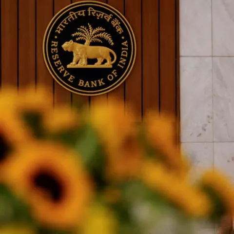 A man speaks on his phone as he walks past the Reserve Bank of India (RBI) logo inside its headquarters in Mumbai, India, February 7, 2025. (Photo: Reuters)