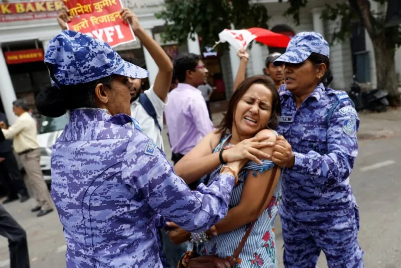 <center><i>A protester is detained by security personnel during a protest by the Cockroach Janta Party (CJP) seeking the resignation of India's Chief Election Commissioner Gyanesh Kumar, near the protest site in New Delhi, India, October 11, 2026. (Photo: Reuters) </center></i> 661745015
