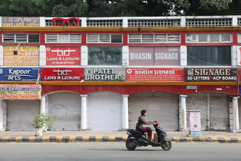 <center><i>A man rides a scooter past shuttered shops in a deserted market, on the second day of a protest by the Cockroach Janta Party (CJP) seeking the resignation of India's Chief Election Commissioner Gyanesh Kumar, in New Delhi, India, October 11, 2026. (Photo: Reuters) </center></i> 3824966004