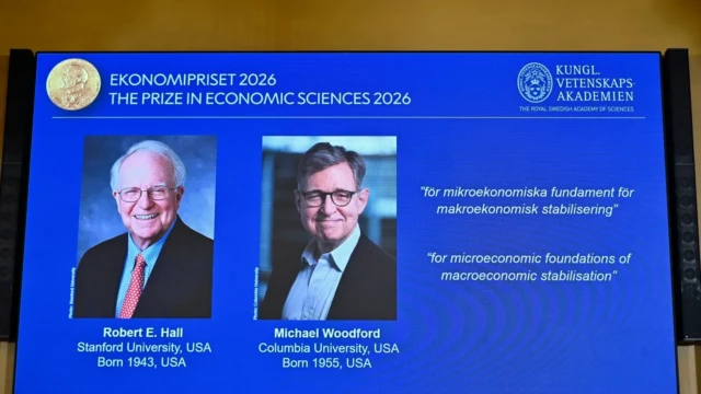 <center><i>Portraits of Robert E. Hall and Michael Woodford are shown on the screen as they are announced as the laureates of the Sveriges Riksbank Prize in Economic Sciences in Memory of Alfred Nobel at the Royal Swedish Academy of Sciences in Stockholm, Sweden, Monday, Oct. 12, 2026. (Photo: AP)</i></center> 2015706776