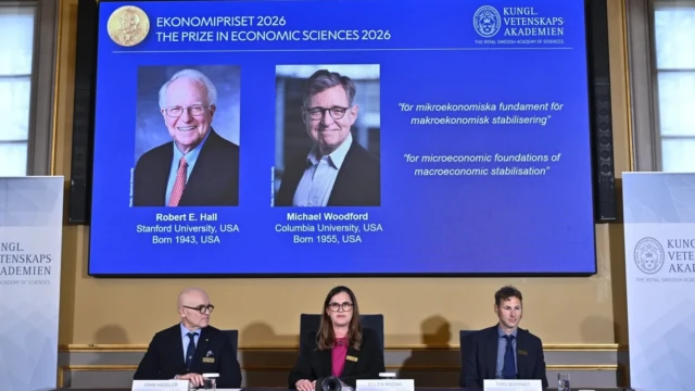 <center><i>Portraits of Robert E. Hall and Michael Woodford are shown on the screen as they are announced as the laureates of the Sveriges Riksbank Prize in Economic Sciences in Memory of Alfred Nobel at the Royal Swedish Academy of Sciences in Stockholm, Sweden, Monday, Oct. 12, 2026. (Photo: AP)</i></center> 3349005235
