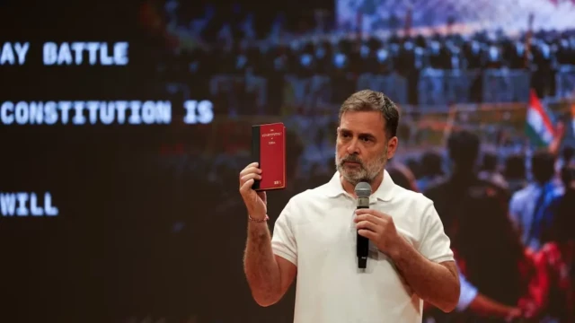 <center><i>Leader of Opposition, Rahul Gandhi shows the Indian constitution during a press conference ahead of a protest march to the Supreme Court against a controversial revision of voter lists that has sparked days of unrest, in New Delhi, India, October 12, 2026. (Photo: Reuters) </i></center> 1002762574