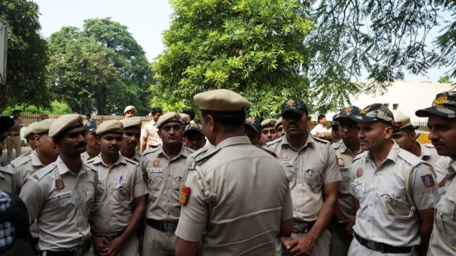 <center><i>Security personnel gather as opposition parties plan a march to the Supreme Court in protest against a controversial revision of voter lists that has sparked days of unrest, in New Delhi, India, October 12, 2026. (Photo: Reuters) </i></center> 2698467836