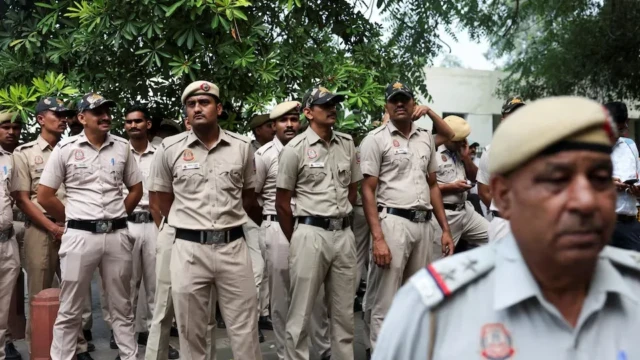 <center><i>Security personnel gather as opposition parties plan a march to the Supreme Court in protest against a controversial revision of voter lists that has sparked days of unrest, in New Delhi, India, October 12, 2026. (Photo: Reuters) </i></center> 564359043