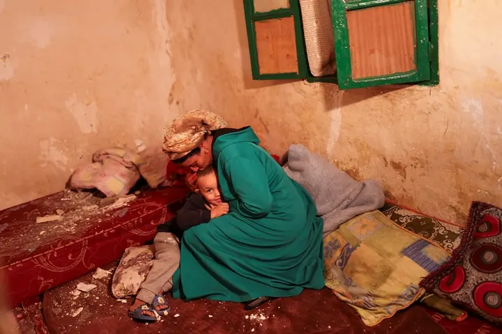 What to know about the Morocco earthquake and the efforts to help 1 Hasna, 44, kisses her son Mohamed Jad, 5, inside their damaged house in Moulay Brahim village, in the province of Al Haouz, following a powerful earthquake in Morocco, September 9, 2023. REUTERS/Nacho Doce