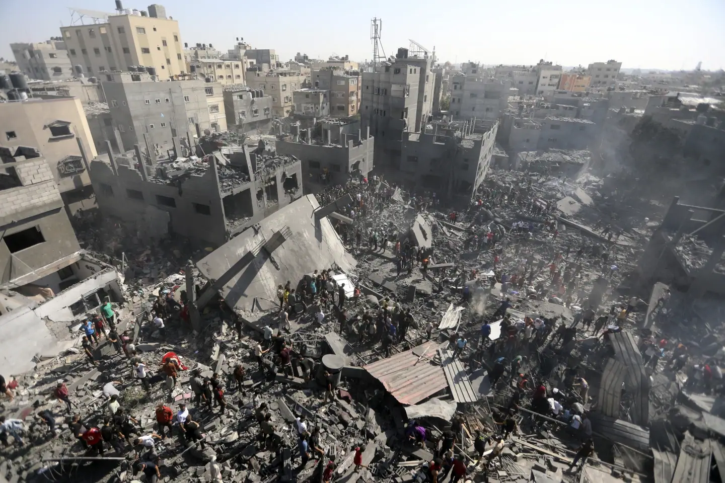 Palestinians inspect the rubble of destroyed buildings following Israeli airstrikes on town of Khan Younis, southern Gaza Strip, Thursday, Oct. 26, 2023. (AP Photo/Mohammed Dahman)