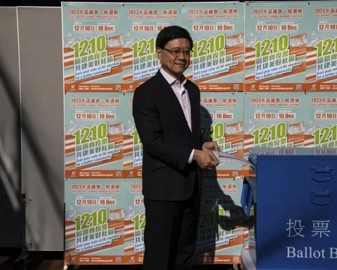Hong Kong’s Chief Executive John Lee casts his ballot at a polling station during the District Council elections in Hong Kong, Sunday, Dec. 10, 2023. Residents went to the polls on Sunday in Hong Kong’s first district council elections since an electoral overhaul was implemented under Beijing’s guidance of “patriots” administering the city, effectively shutting out all pro-democracy candidates.(AP Photo/Louise Delmotte)