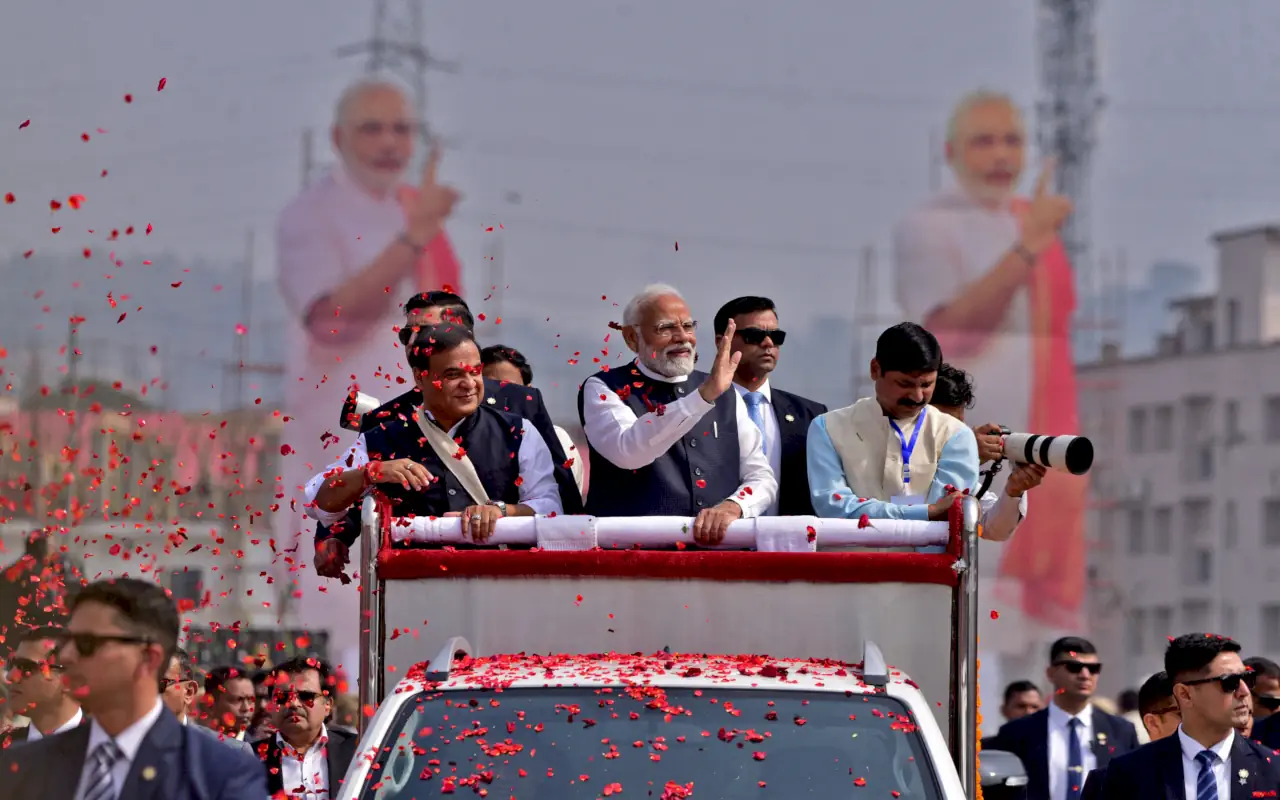 India's Prime Minister Narendra Modi waves to his supporters as he arrives to attend a rally in Guwahati, India, February 4, 2024. REUTERS/Anuwar Hazarika