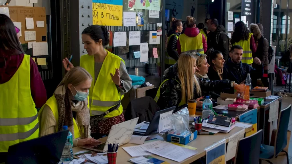 Poland has opened its arms to nearly 1 million Ukrainian refugees, but will they be able to stay for the long term? 3 Polish volunteers rushed to aid recent Ukrainian refugees arriving at the Wroclaw railway station in early 2022