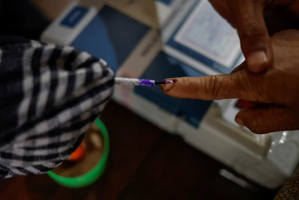 India votes in gigantic election dominated by jobs, Hindu pride and Modi 2 A voter gets his finger inked before casting his vote at a remote polling station in Nongriat village