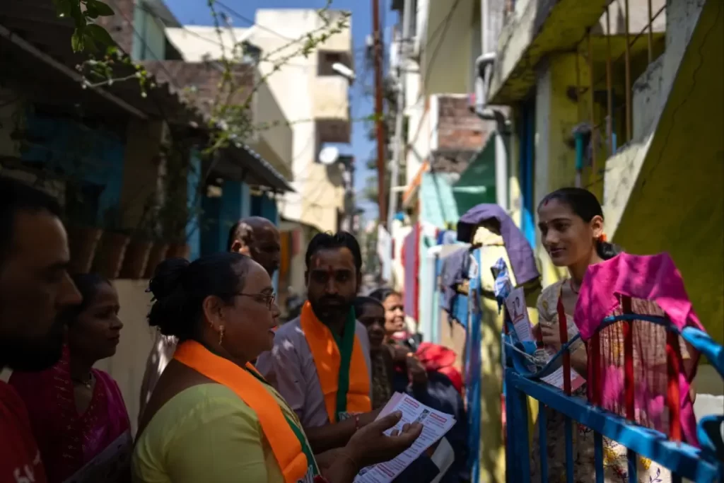 India votes in gigantic election dominated by jobs, Hindu pride and Modi 1 BJP activists go door to door in Bhopal
