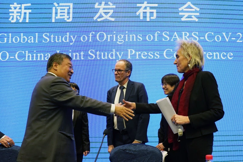 How the search for the origins of COVID-19 turned politically poisonous! 3 Marion Koopmans right and Peter Ben Embarek center of the World Health Organization team say farewell