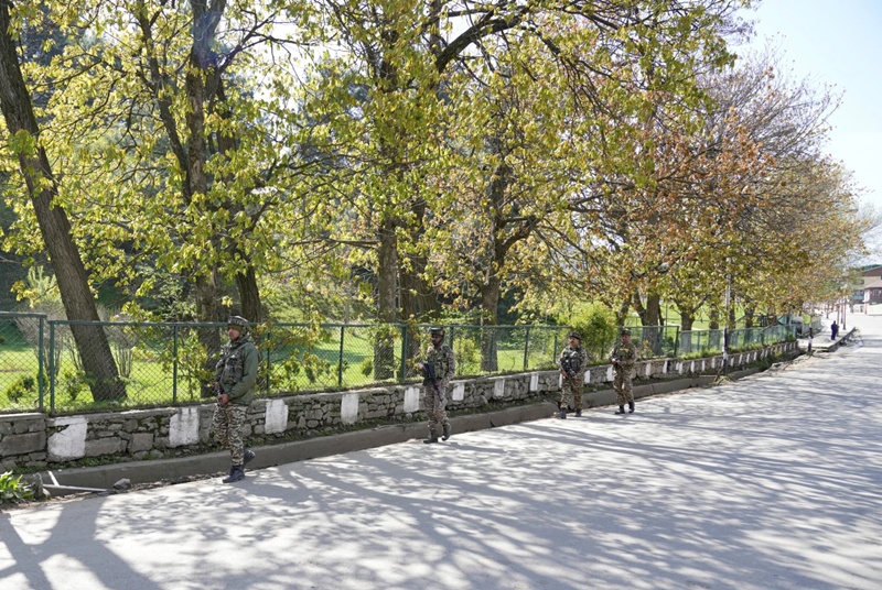 Investigators probe deadly attack in disputed Kashmir as India vows to punish perpetrators 3 Security personnel patrol street