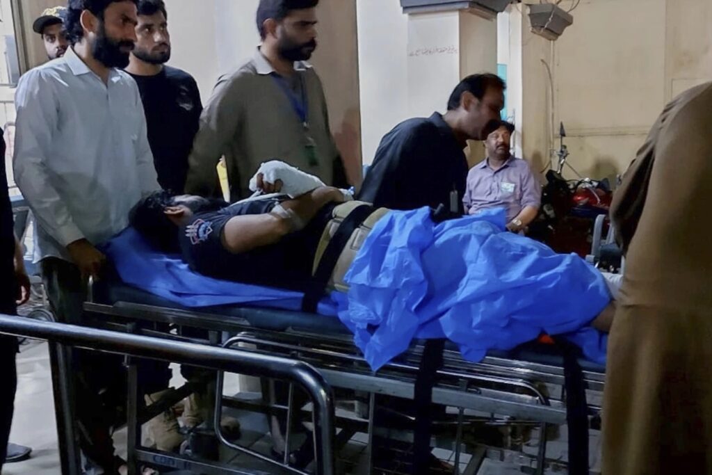 India fires missiles into Pakistani territory in what Islambad calls ‘act of war’ 4 Workers transport a man