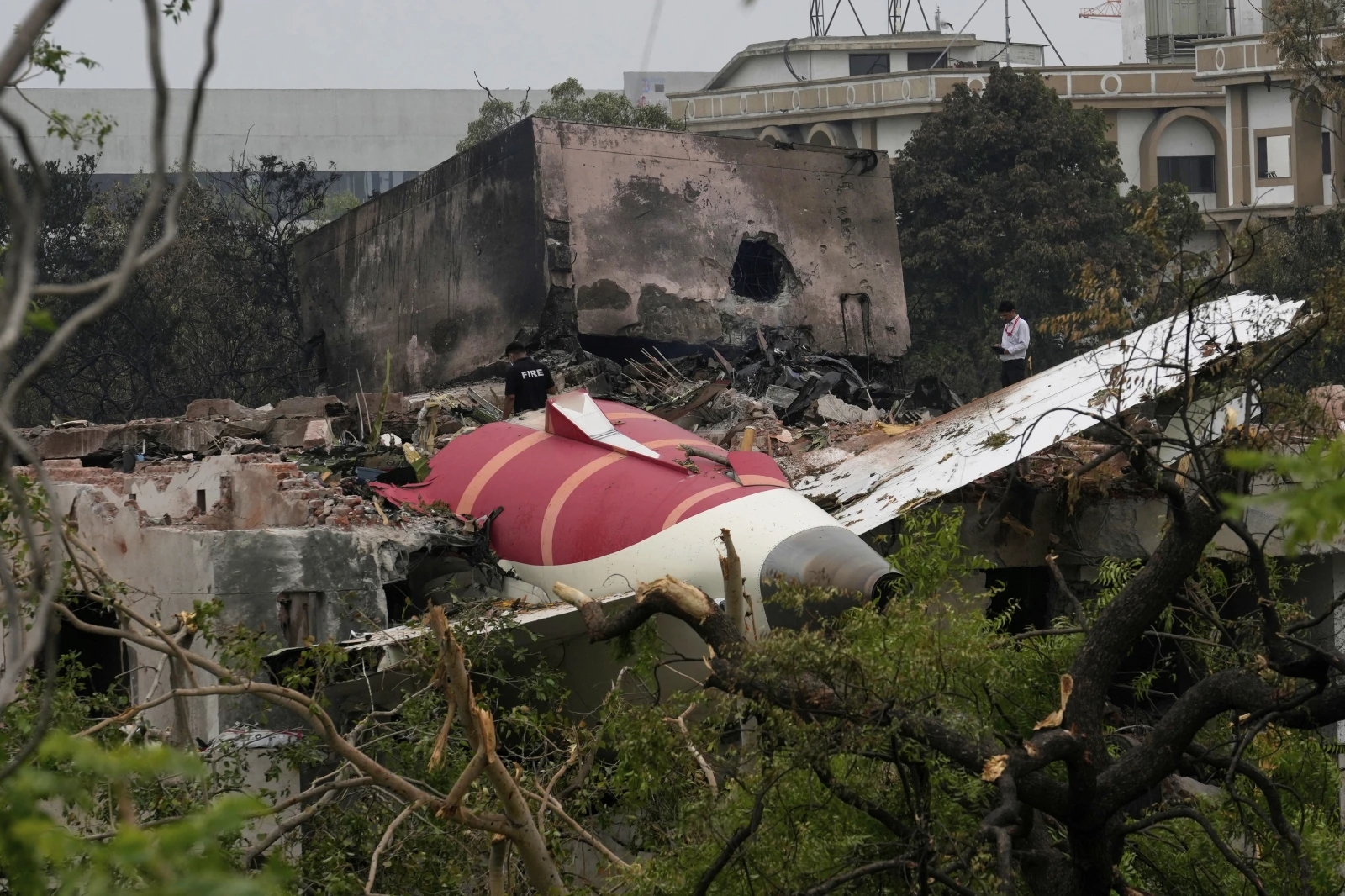 Investigators search the Air India crash site for clues to the cause and more potential victims 2 Parts of an Air India plane