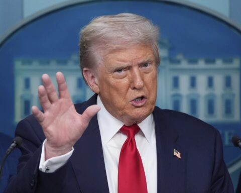 President Donald Trump speaks with reporters