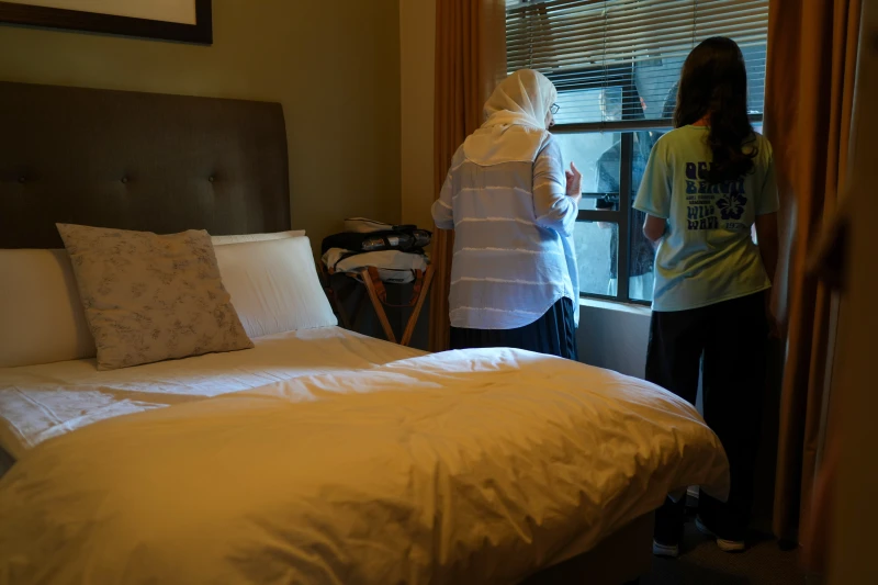 AP finds an Israeli group discreetly organized the mystery flights evacuating Palestinians from Gaza 5 Palestinians who traveled to South Africa via a charter flight organized by an Israeli group whose founder supported U.S. President Donald Trump’s proposal to resettle Palestinians from Gaza stand in their temporary flat in Johannesburg, South Africa, Wednesday, Feb. 4, 2026. (AP Photo/Jerome Delay)