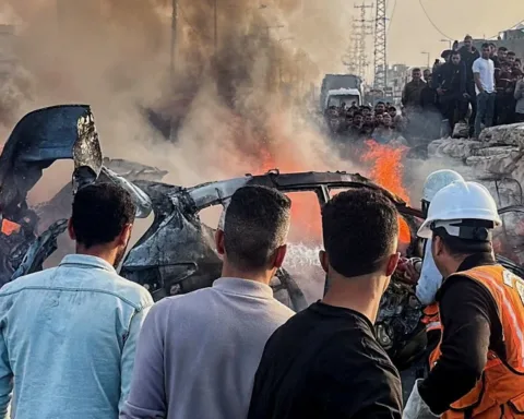 Palestinians inspect the site of what medics said was an Israeli airstrike on a car near the entrance to Zawayda town, amid the U.S.-Israeli conflict with Iran, in the central Gaza Strip, April 4, 2026. Picture taken with a mobile phone. REUTERS/Stringer TPX IMAGES OF THE DAY