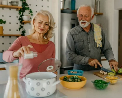 Elderly Couple adding salt