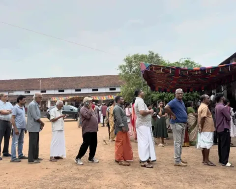 People queue up to vote outside a polling booth during the Kerala state elections in Kochi, India, Thursday, April 9, 2026.