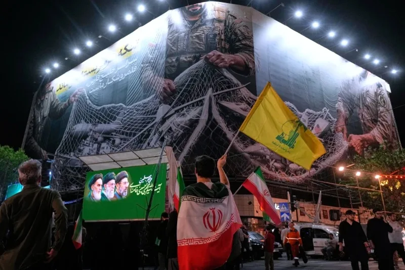 China’s top envoy meets with Iran’s in Beijing as Trump pauses US effort in the Strait 4 Iranian Demonstrator